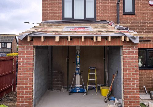 Views of a newly constructed extension shell, the doors and roof are yet to be built.